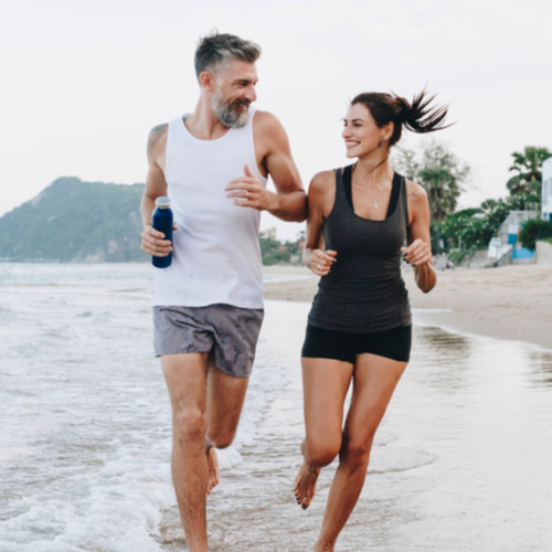 Couple jogging on a beach